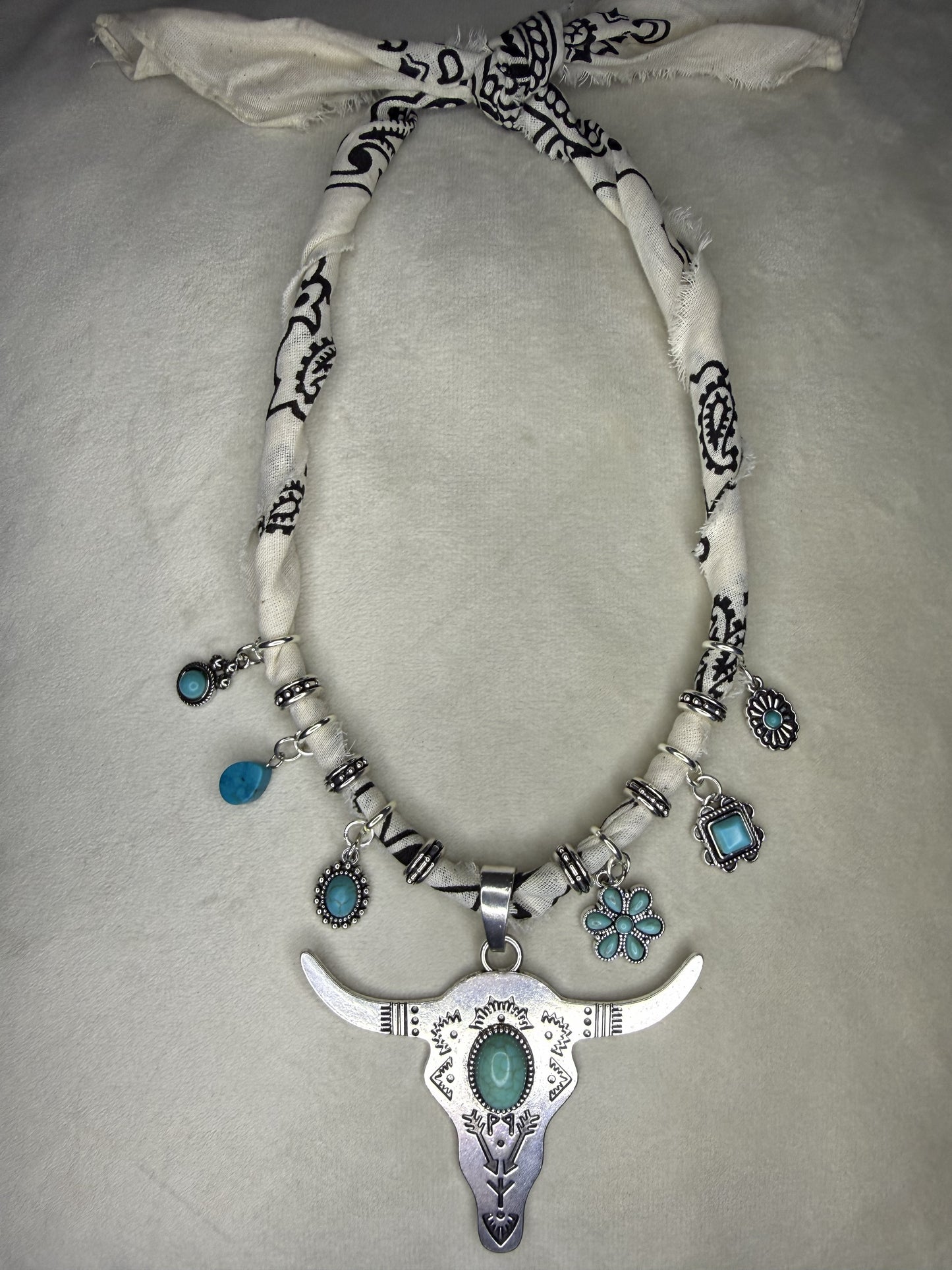 Necklace with decorative elements on a light gray background