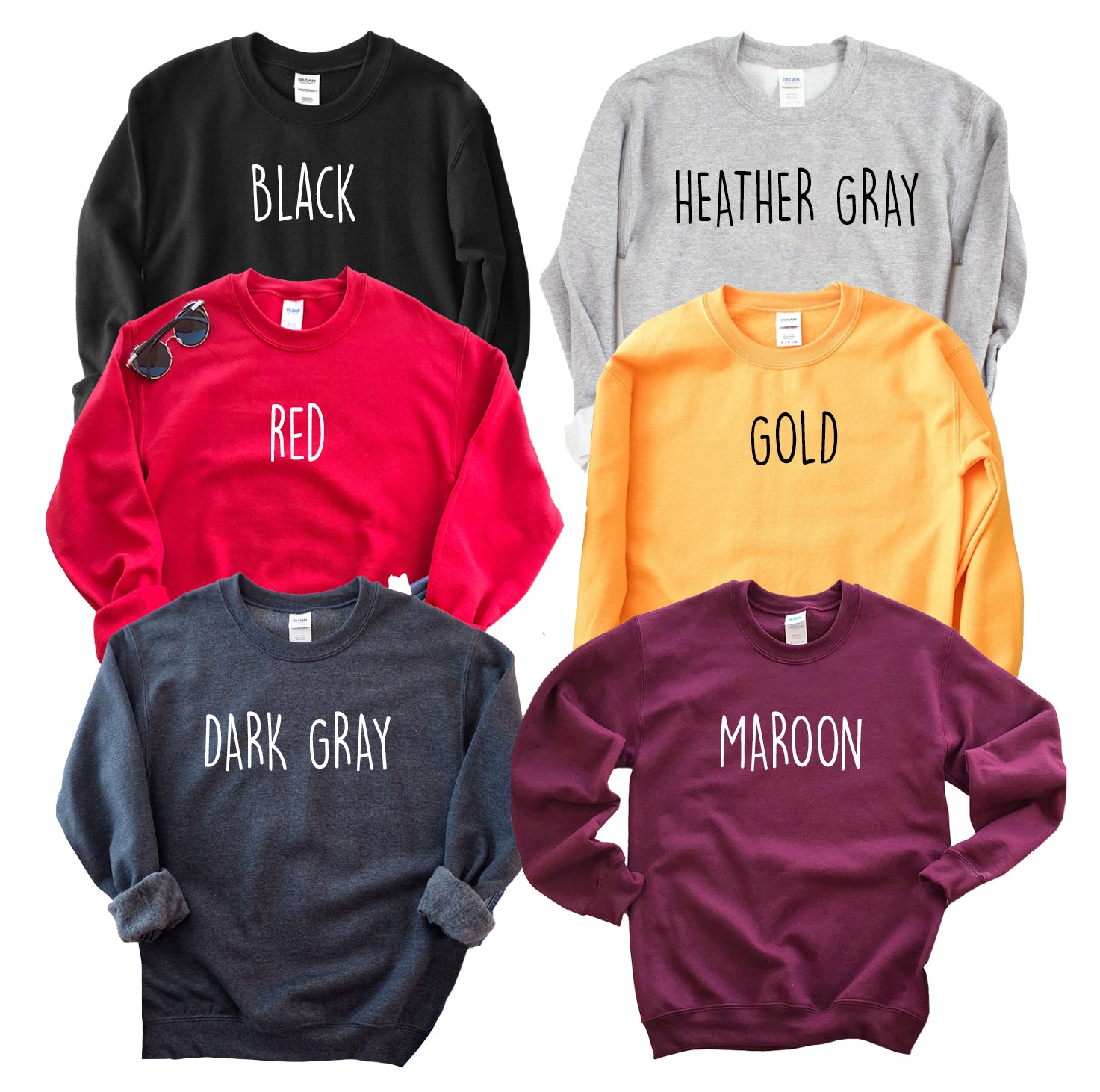 Collection of sweatshirts in various colors with color names printed on them.