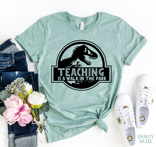 🦕 Teaching Is A Walk In The Park Tee – Funny Teacher Graphic Shirt